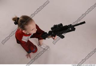 DENISA KNEELING POSE WITH GUN